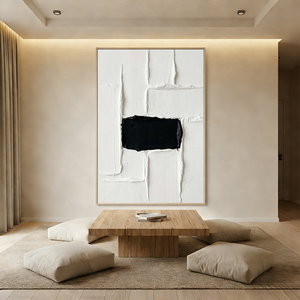 A hand-painted 3D textured oil painting featuring a central black rectangular block on a white impasto background, displayed in a serene modern Wabi-Sabi styled room.