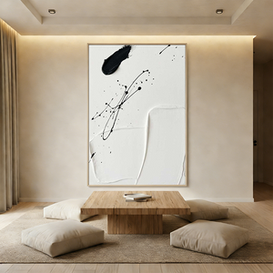 Large hand-painted 3D textured black and white abstract oil painting with heavy impasto layers resembling rock strata, styled in a minimalist Boho living room.
