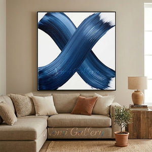 Hand-painted blue abstract cross brushstrokes on a white canvas background, showing rich texture and deep navy blue tones.
