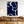 Large handmade abstract oil painting with fluid, deep cobalt blue organic shapes and winding white lines, framed in natural wood and displayed in a minimalist Japandi living room above a low wooden tea table with floor cushions.