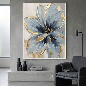 Hand-painted textured dusty blue and navy blooming flower oil painting with luxury gold foil accents on canvas, styled in a modern gray living room.