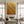 100% hand-painted heavy textured gold abstract oil painting featuring sculptural impasto waves on canvas, styled as a luxury oversized statement piece above a fireplace in a modern living room setting as seen in gold-textured-wall-art-for-room-decor.jpg and gold-textured-wall-art-for-modern-room-decor.jpg.
