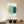 Handmade minimalist abstract canvas painting featuring overlapping translucent organic shapes in soft yellow, light mint green, and deep teal on a soft cream background.