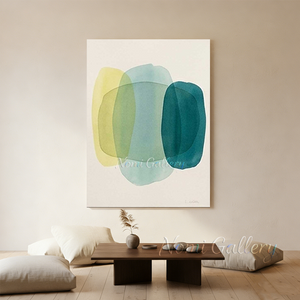 Handmade minimalist abstract canvas painting featuring overlapping translucent organic shapes in soft yellow, light mint green, and deep teal on a soft cream background.