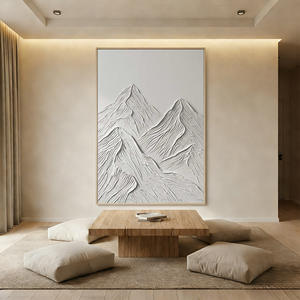 A hand-painted minimalist oil painting depicting abstract mountain peaks with a heavy 3D textured foreground in beige and dark gray, styled in a contemporary neutral living room.