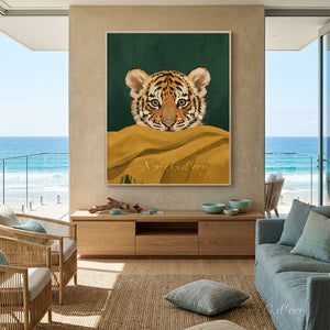 Heartwarming handmade modernist oil painting of an innocent tiger cub with wide brown eyes peeking over a thick golden yellow fringed blanket against a dark emerald green background.