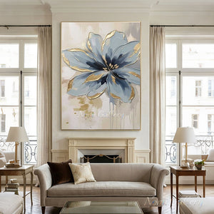 Hand-painted textured abstract oil painting of a large single blue flower with prominent metallic gold foil accents on the petal edges against a beige and cream white background with paint drips.