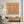 Hand-painted minimalist Wabi-Sabi oil painting featuring a 3 by 3 grid of nine heavily textured terracotta red squares with raw, deckled edges over a mottled warm beige sand-toned background.